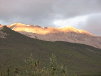 Evening light on the mountains above Muncho Lake
